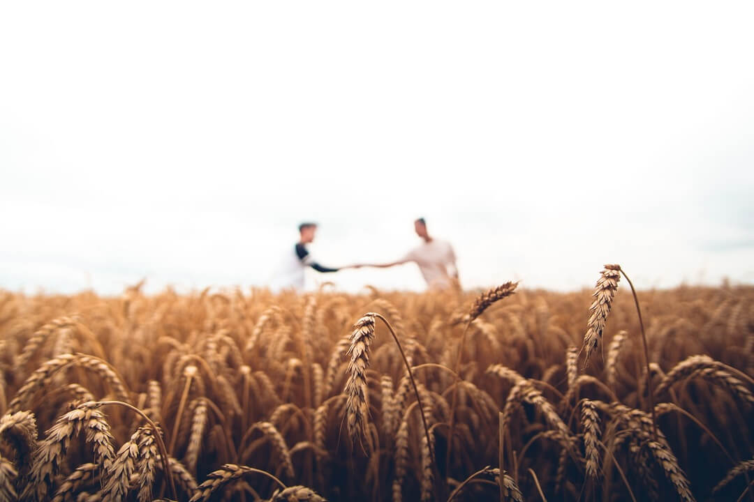 2 Men Standing On A Field with Inherited Mineral Rights